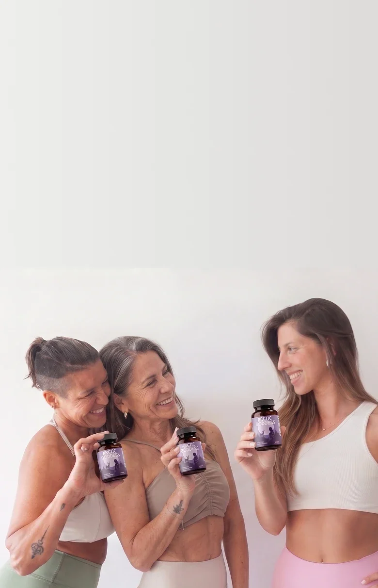 Three women holding the product